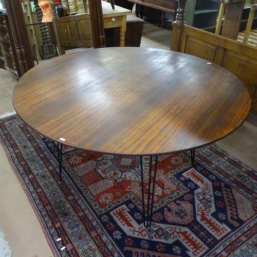 1541 - A mid-century circular teak dining table, on hairpin legs, W137cm , H73cm