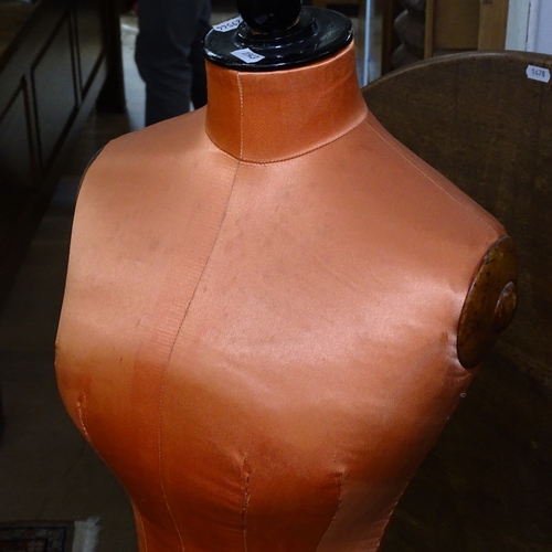 1543 - A Victorian Siegel & Stockman mannequin, recovered in orange silk, on an ebonised telescopic stand, ... 