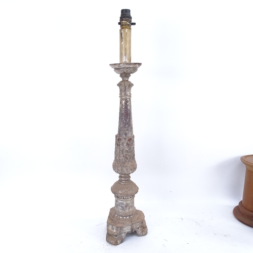 400 - A 19th century painted and gilded pricket table candlestick, a silvered carved wood converted lamp, ... 