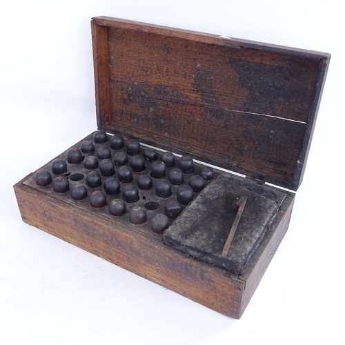 413 - A 19th century set of printer's letter and number punches, with turned wood handles and brass tips, ... 