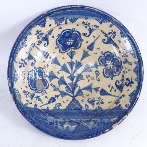 414 - A group of various glazed pottery faience wares, including Turkish? floral plate (5)