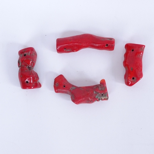 418 - A collection of carved and polished red coral bead necklaces and bracelets, and a piece of rough cor... 