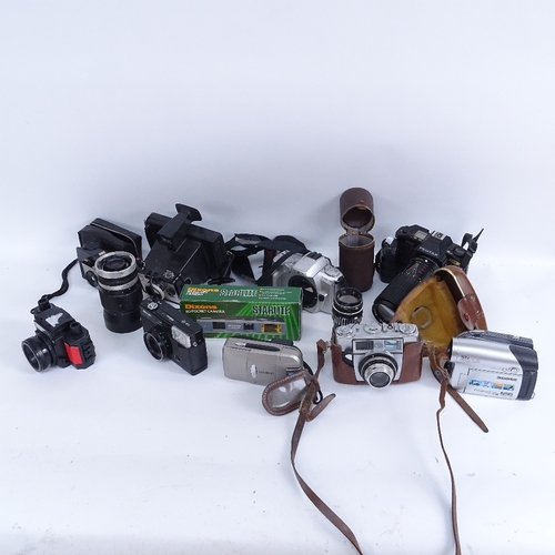 426 - A large collection of various cameras and accessories, including Pentax, Minolta, Kodak etc