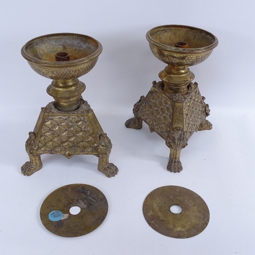 427 - A set of 4 Antique cast-brass candle stands, with lion paw feet, and a pair of cast-brass lamp bases... 