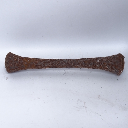 443 - A large 19th century cast-iron pestle and mortar, mortar height 25cm