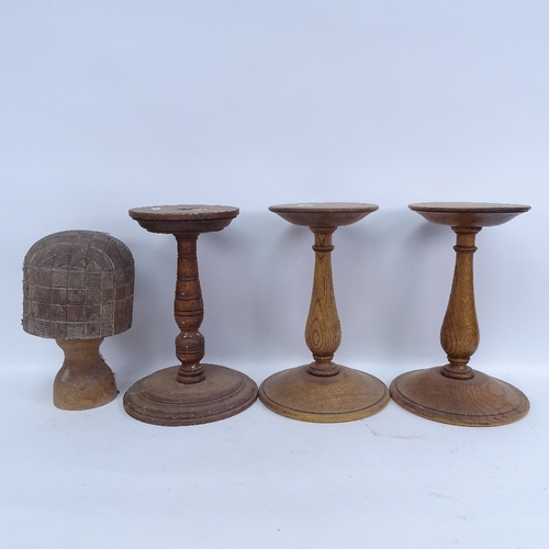 445 - 4 turned wood hat/wig stands, largest height 31cm (4)