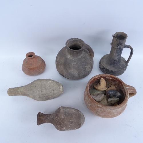 446 - A quantity of Middle Eastern pottery antiquities and fragments, including wine jug, vessels and amph... 