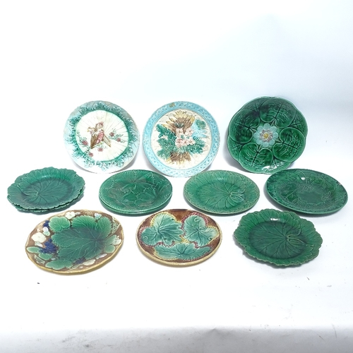 464 - A collection of Majolica ceramic jugs and plates, including corn on the cob and leaf plates