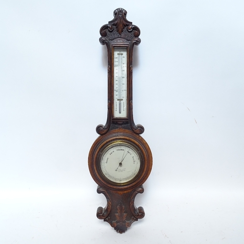 484 - An oak-cased wheel barometer and thermometer, by Newton & Co of London, overall height 68cm