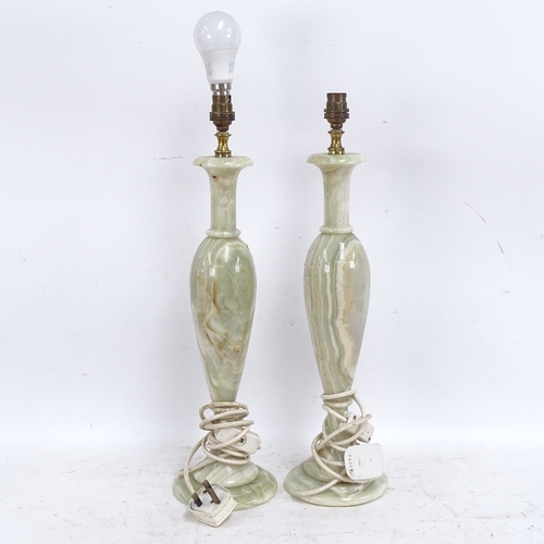 582 - A pair of carved and polished green onyx pedestal table lamps, height excluding fitting 45cm