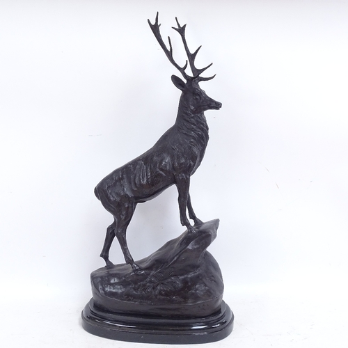 583 - After Joules Moigniez, a patinated bronze sculpture depicting stag on a rocky outcrop, on polished m... 