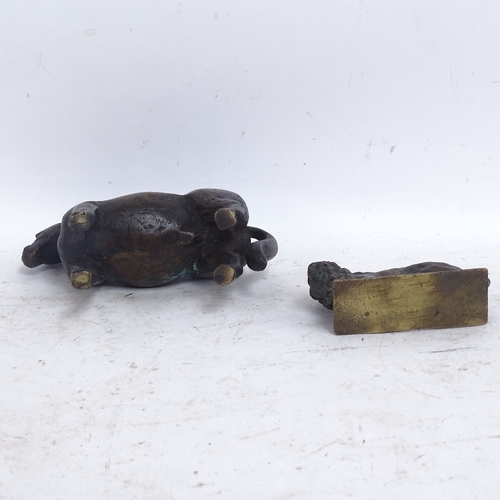 585 - A heavy cast-brass horse and lion, horse length 17cm (2)