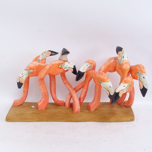 593 - Clive Fredriksson, carved and painted wood sculpture, flamboyance of flamingos, on polished wood bas... 