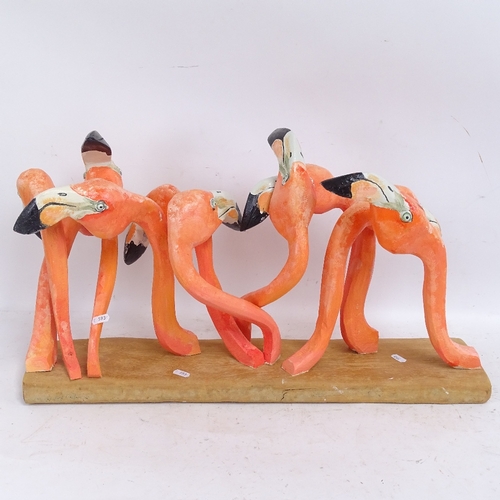 593 - Clive Fredriksson, carved and painted wood sculpture, flamboyance of flamingos, on polished wood bas... 