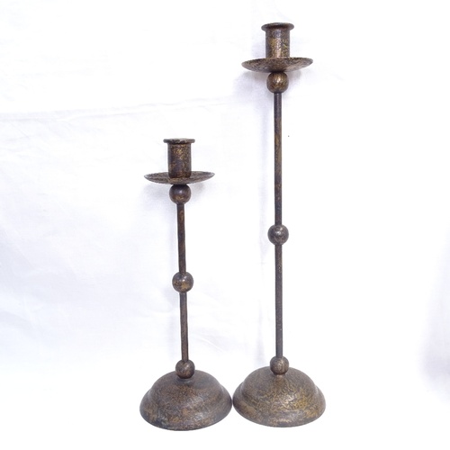 217 - A pair of mottled brass candlesticks, Oriental trays etc