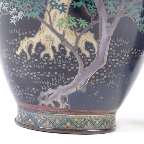 23 - A pair of Japanese Meiji period cloisonne vases, dark blue enamel bodies with eagles in Acer trees, ... 