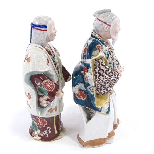 26 - 2 Japanese Meiji period polychrome porcelain figures, of actors wearing noh masks, tallest 23cm.