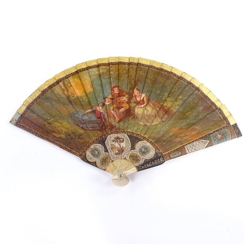 39 - A 19th century Vernis Martin style fan, hand painted romantic and landscape scenes with intricate fl... 