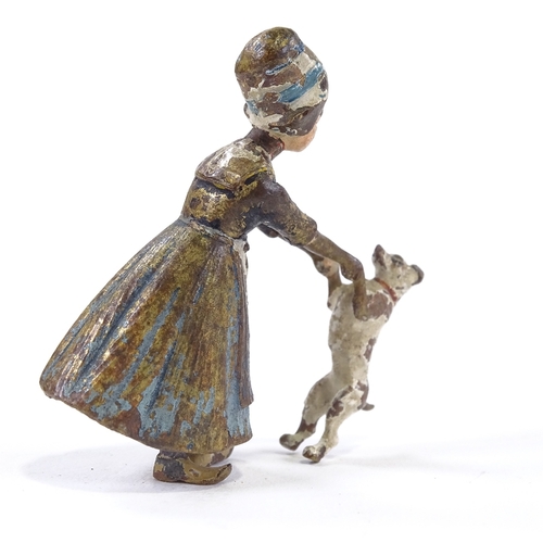 45 - A Vienna cold painted bronze dutch girl with dog, height 5cm.