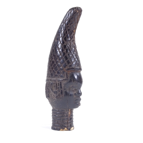 5 - An Antique Benin stained ivory Queen mother head with neck rings, height 18cm. Probably late 19th ce... 