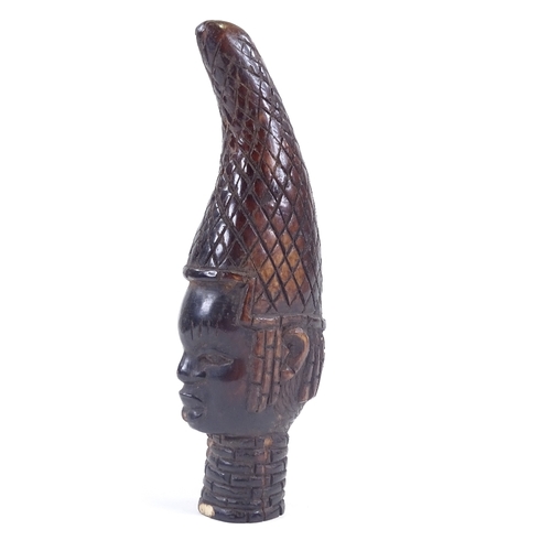 5 - An Antique Benin stained ivory Queen mother head with neck rings, height 18cm. Probably late 19th ce... 