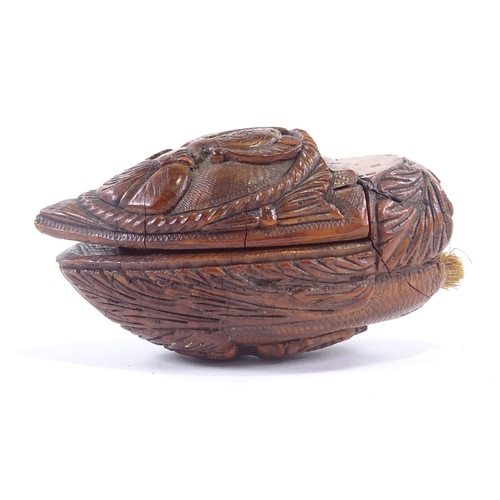 7 - An early 19th century coquilla nut snuff box, carved classical figure on lid and woman on base with ... 