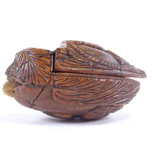 7 - An early 19th century coquilla nut snuff box, carved classical figure on lid and woman on base with ... 
