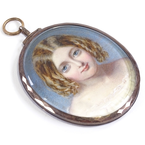 8 - A 19th century portrait minature of a girl, watercolour on ivory, in a hinged white metal oval penda... 