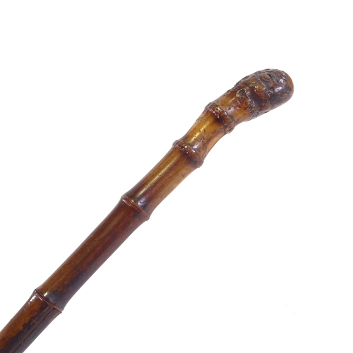 83 - A square section bamboo walking cane, with Solingen steel blade, length 90cm.