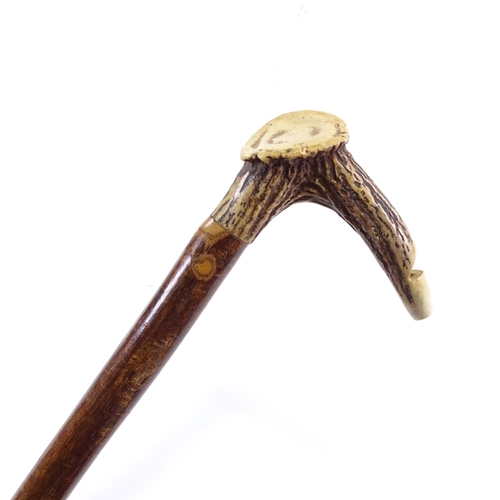 86 - A horn handled, whistle walking cane, length 87cm.