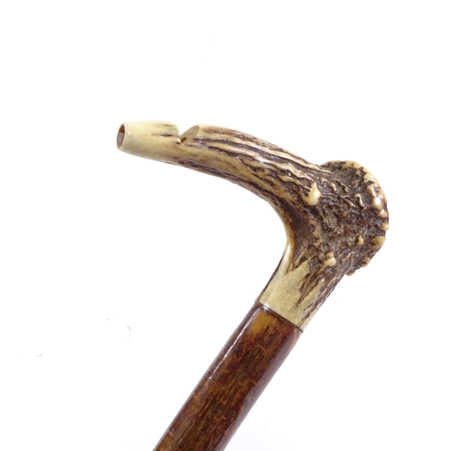 86 - A horn handled, whistle walking cane, length 87cm.