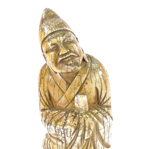 89 - A Chinese carved ivory sage figure, 18th/19th century, height 21cm.