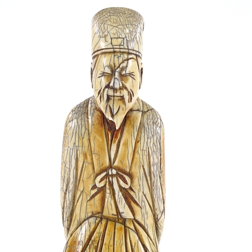 90 - A Chinese carved ivory sage figure, 18th/19th century, height 20cm.