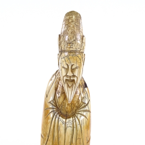 91 - A Chinese carved ivory sage figure, 18th/19th century, height 20cm.