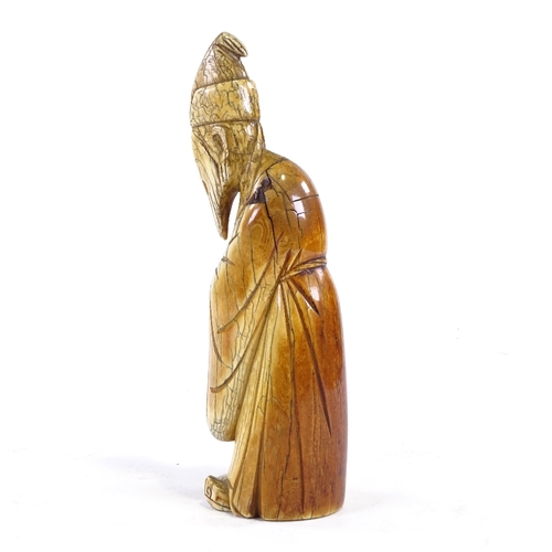 91 - A Chinese carved ivory sage figure, 18th/19th century, height 20cm.