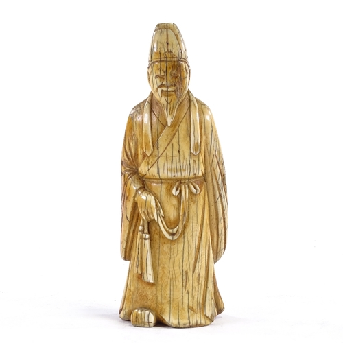 92 - A Chinese carved ivory sage figure, 18th/19th century, height 17cm.