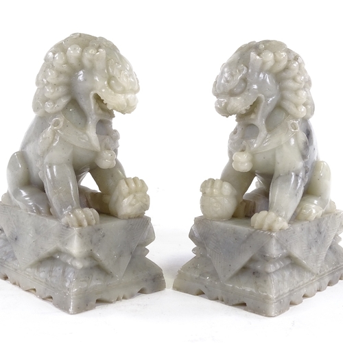 98 - A pair of Chinese carved soapstone Dogs of Fo, height 17cm.