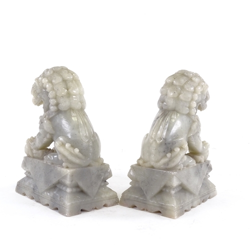 98 - A pair of Chinese carved soapstone Dogs of Fo, height 17cm.