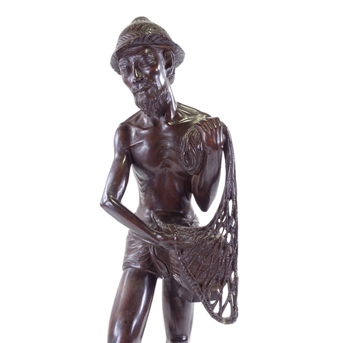 100 - A Chinese hardwood carving of a fisherman, early 20th century, height 65cm.