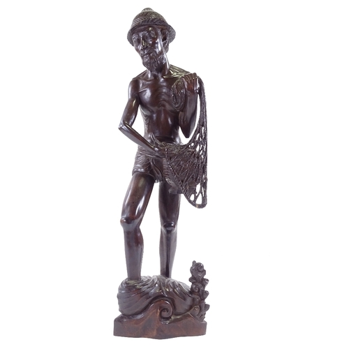 100 - A Chinese hardwood carving of a fisherman, early 20th century, height 65cm.