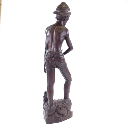 100 - A Chinese hardwood carving of a fisherman, early 20th century, height 65cm.