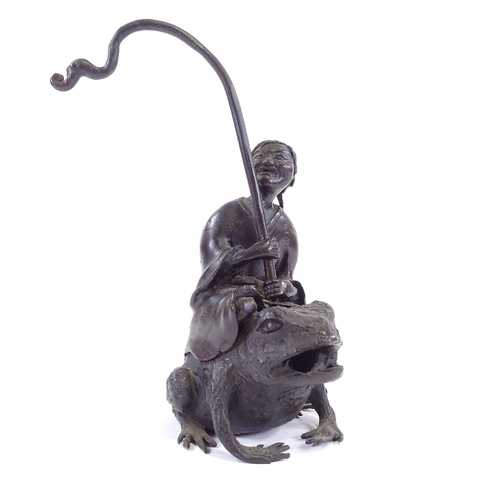 101 - A Chinese patinated bronze sculpture of a man riding a toad, height to man's head 16cm