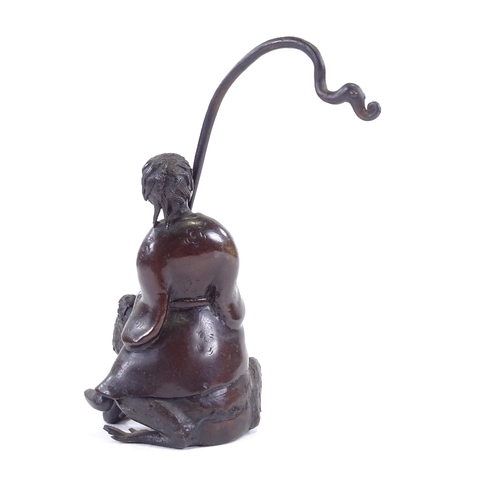 101 - A Chinese patinated bronze sculpture of a man riding a toad, height to man's head 16cm