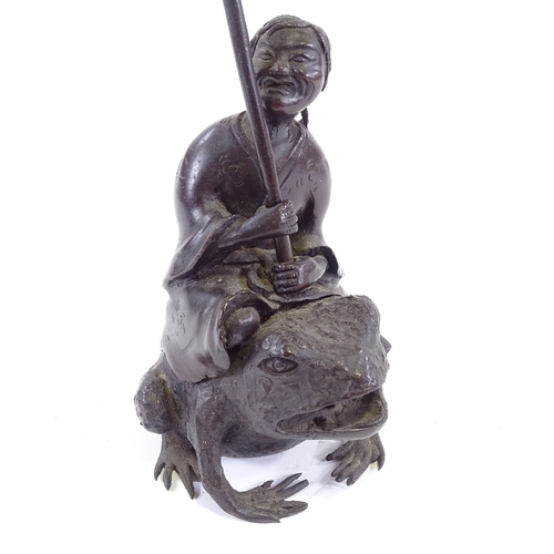 101 - A Chinese patinated bronze sculpture of a man riding a toad, height to man's head 16cm