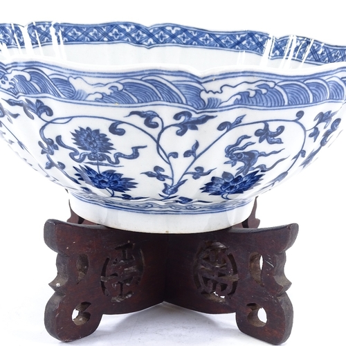 103 - A Chinese blue and white porcelain bowl, hand painted decoration, diameter 25cm, on hardwood stand