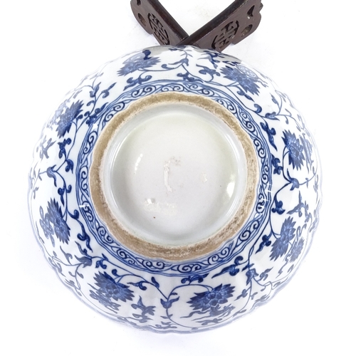 103 - A Chinese blue and white porcelain bowl, hand painted decoration, diameter 25cm, on hardwood stand