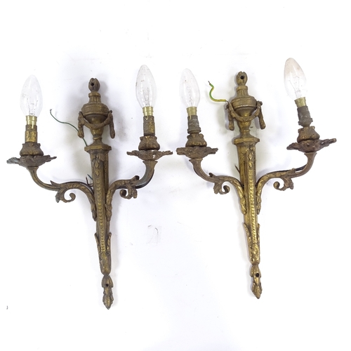 104 - A pair of gilt-brass Adam style twin-branch wall light fittings, circa 1900, height 40cm