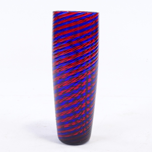 106 - A blue and red glass spiral hand made cylinder vase, height 17cm.