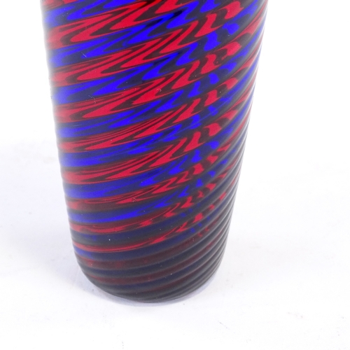 106 - A blue and red glass spiral hand made cylinder vase, height 17cm.