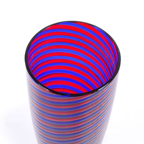 106 - A blue and red glass spiral hand made cylinder vase, height 17cm.